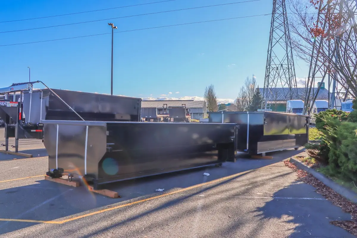 Roll-off dumpster ready for waste disposal at job site for 2 Yard Dumpster Rental in Rochester